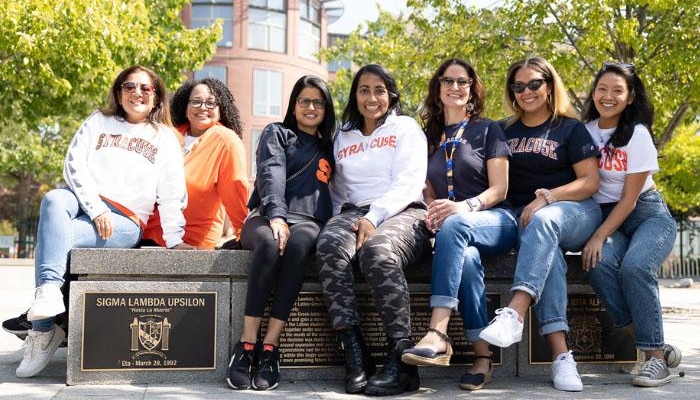 SLU Scholarship Sigma Lambda Upsilon founders and members sitting on plaque